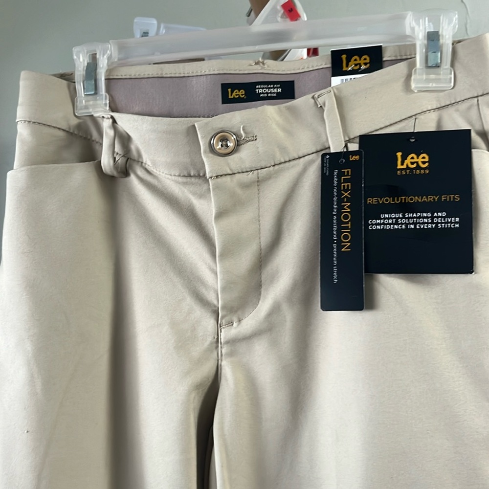 Women’s regular fit mid rise trouser. Flex motion. Brand new with tags.